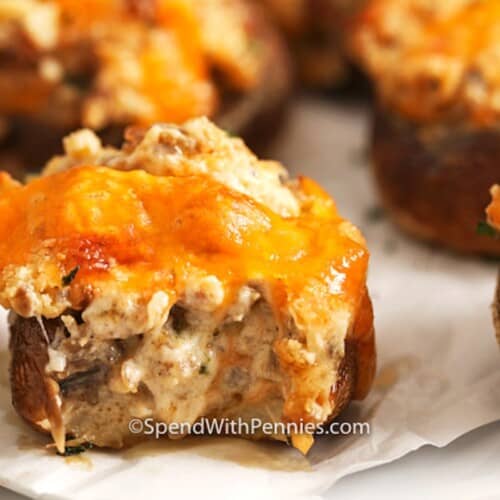 sausage stuffed mushroom on a baking dish
