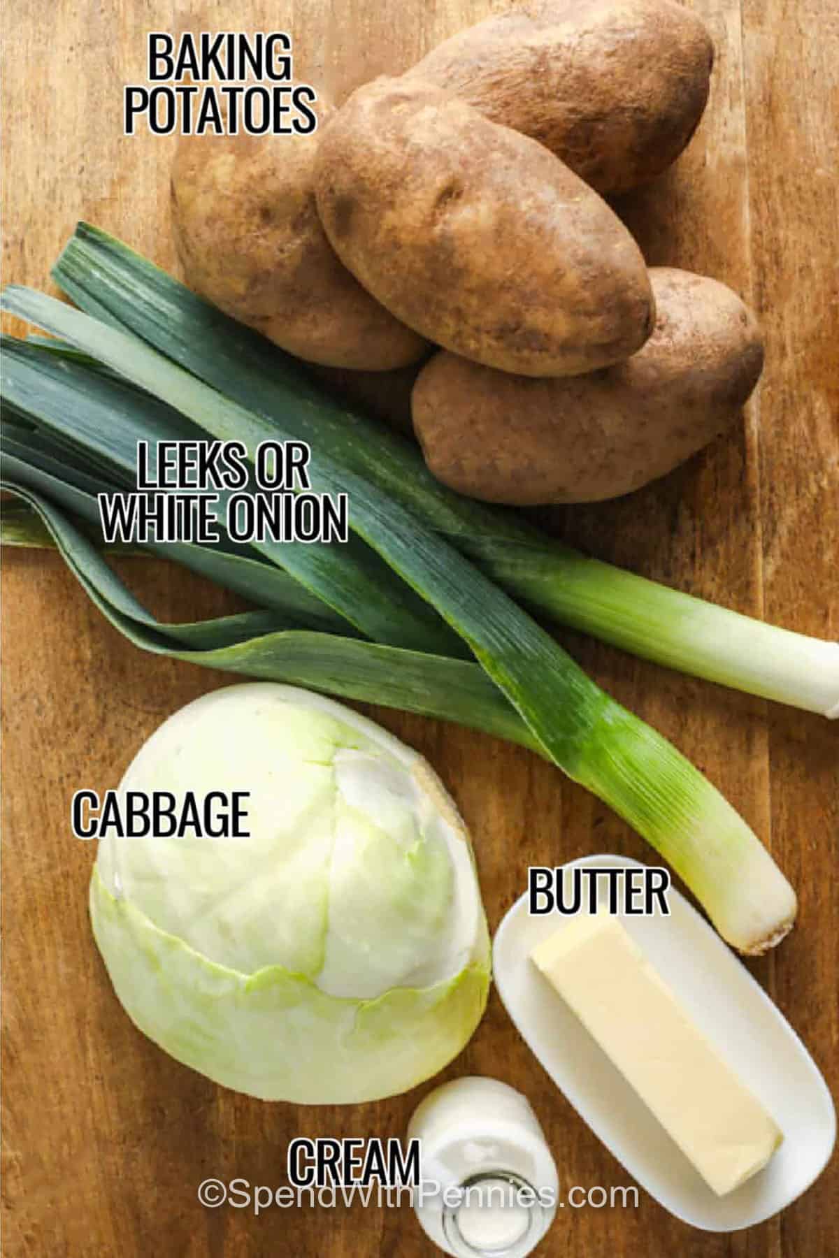 baking potatoes , leeks , cabbage , butter and cream with labels to make Colcannon Recipe