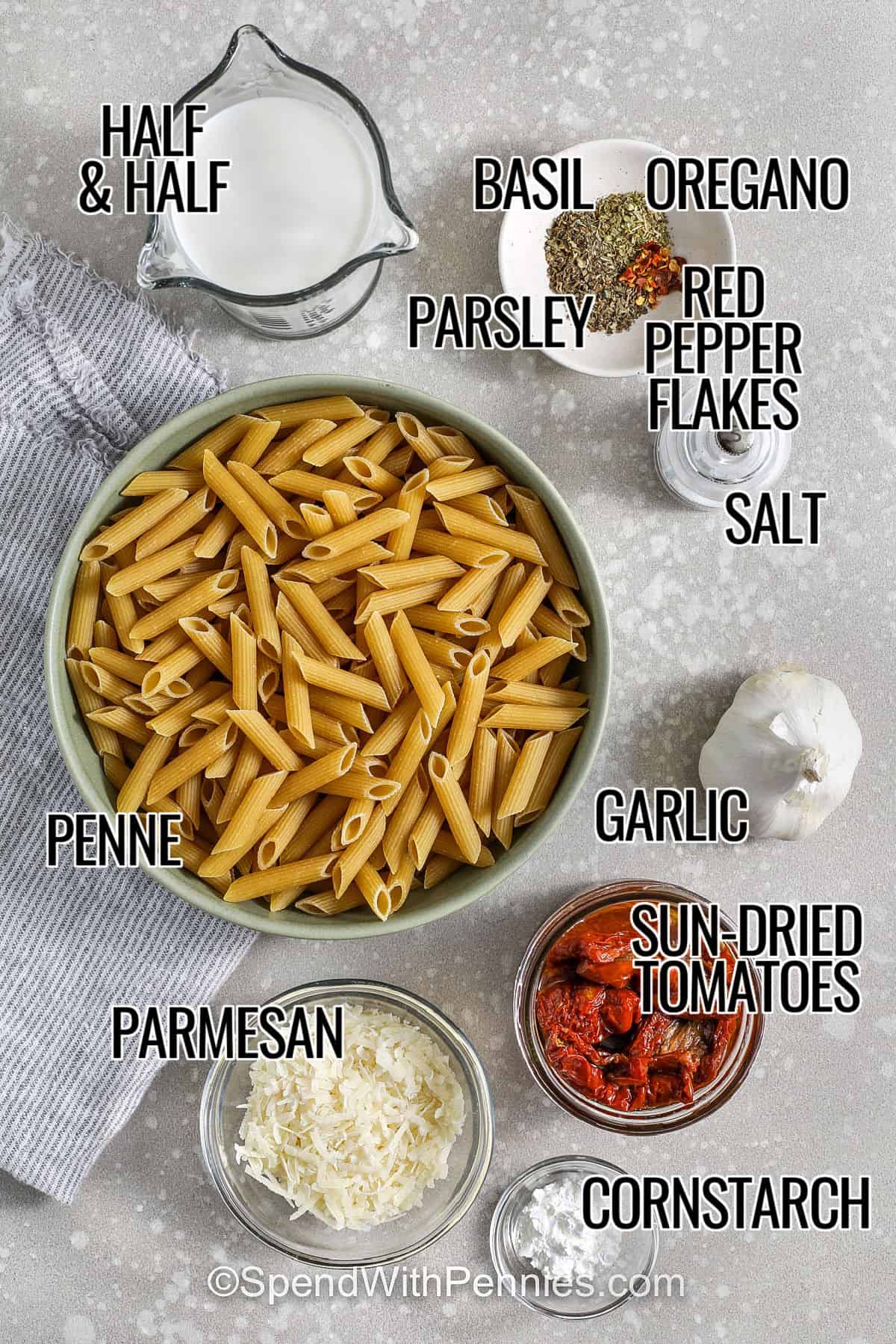 Sun dried tomato pasta is a great option for leftovers because the sauce reheats easily. Cook penne and reserve pasta water, then build the sauce with garlic and herbs in sun-dried tomato oil. Half-and-half thickens it, and Parmesan melts in for delicious richness. Reheat with a splash of milk or water and stir often to keep the sauce creamy and smooth. #spendwithpennies ingredients with labels to make sun dried tomato pasta