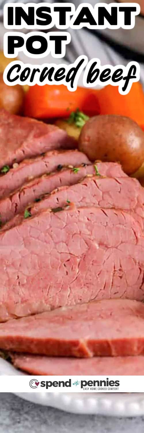 This Instant Pot corned beef and cabbage recipe delivers classic comfort with a simple, one-pot method. The corned beef brisket cooks on a trivet with garlic, onion, beer, and broth, then the cabbage, potatoes, and carrots finish in minutes. Slice across the grain for the most tender texture, and spoon a little pot liquid over the meat for extra moisture and flavor. #spendwithpennies plate of Instant Pot Corned Beef with veggies and writing