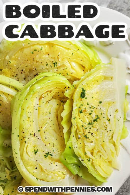 This boiled cabbage recipe delivers tender cabbage wedges with a buttery finish in under 15 minutes. Green cabbage boils in salted water until just soft, then drains well so it stays flavorful instead of watery. Melted butter, salt, and black pepper keep it classic. Add bacon drippings to the pot for a smoky boost, or use broth for extra depth. It pairs perfectly with ham, sausage, or corned beef. #spendwithpennies boiled cabbage on a plate with writing