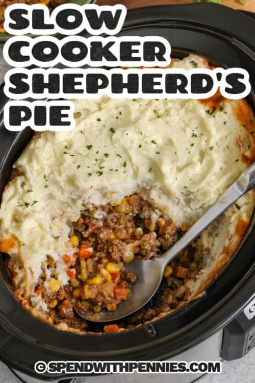 Slow Cooker shepherd's pie is comfort food made easy with browned ground lamb or beef, diced onion, and frozen mixed vegetables. A quick whisked sauce with beef broth, brown gravy mix, Worcestershire, and tomato paste turns rich as it cooks. Spread thick mashed potatoes over the top and cook until warm and ready for serving. #spendwithpennies Slow Cooker Shepherd's Pie with a title