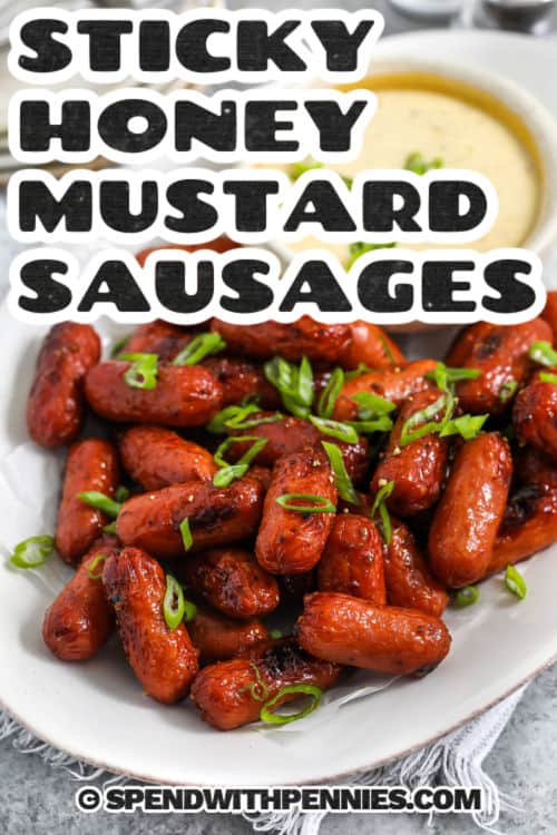 close up of plated Sticky Honey Mustard Sausage with a title