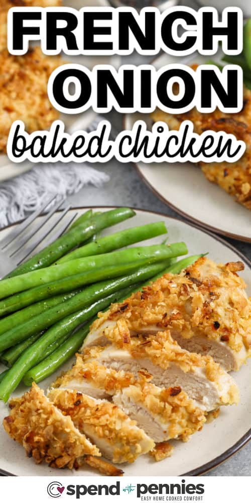 French onion baked chicken is a family-friendly baked chicken breasts recipe with a crisp, savory topping. Crispy fried onions add the crunch and flavor, and Dijon gives the coating a little zing. Bake on a sheet pan until perfectly golden, juicy, and crispy. Pair with mashed potatoes or green beans. #spendwithpennies french onion baked chicken on a white plate with a fork, beans and writing
