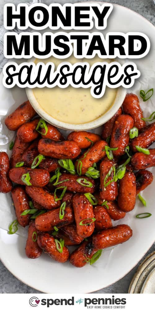 Sticky Honey Mustard Sausage on a plate with dip and a title