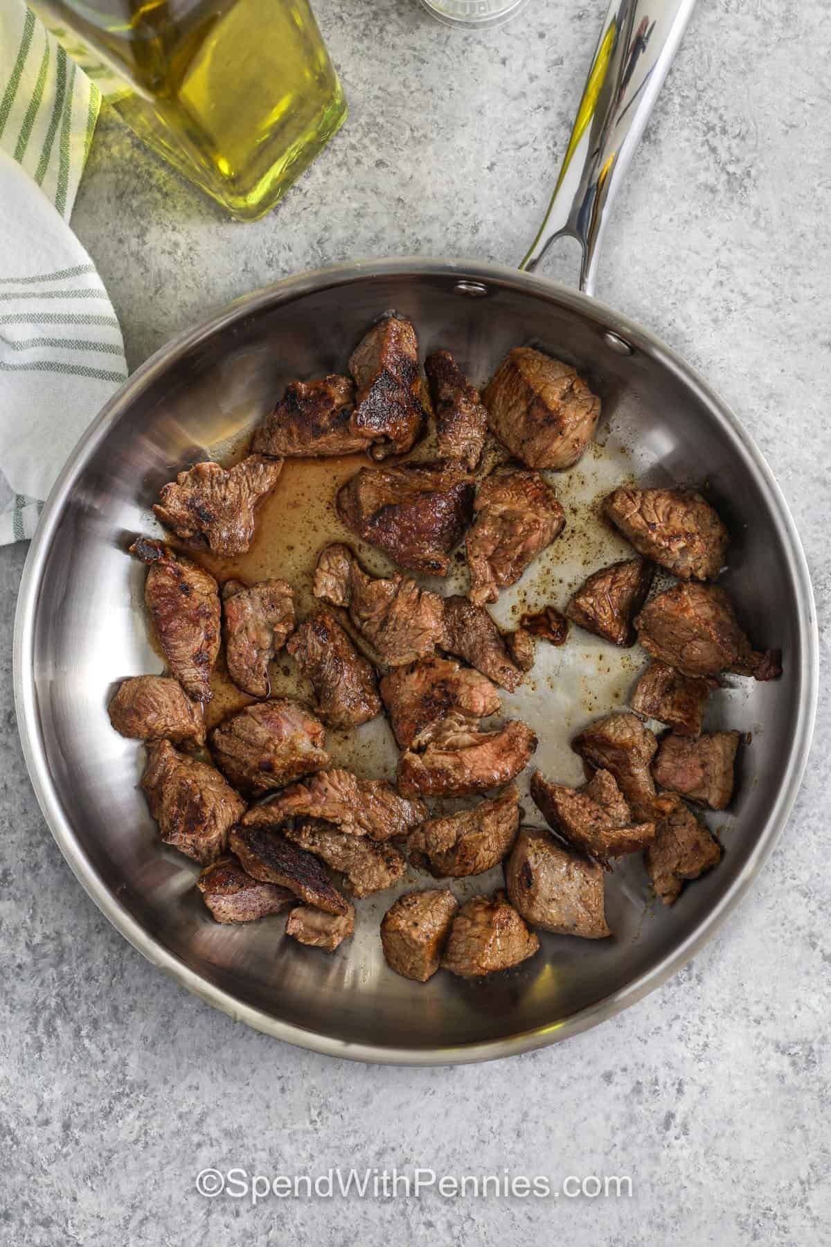 cooking beed to make Slow Cooker Beef and Cabbage Stew