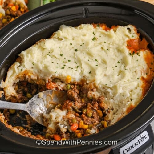 pot of Slow Cooker Shepherd's Pie with a spoon