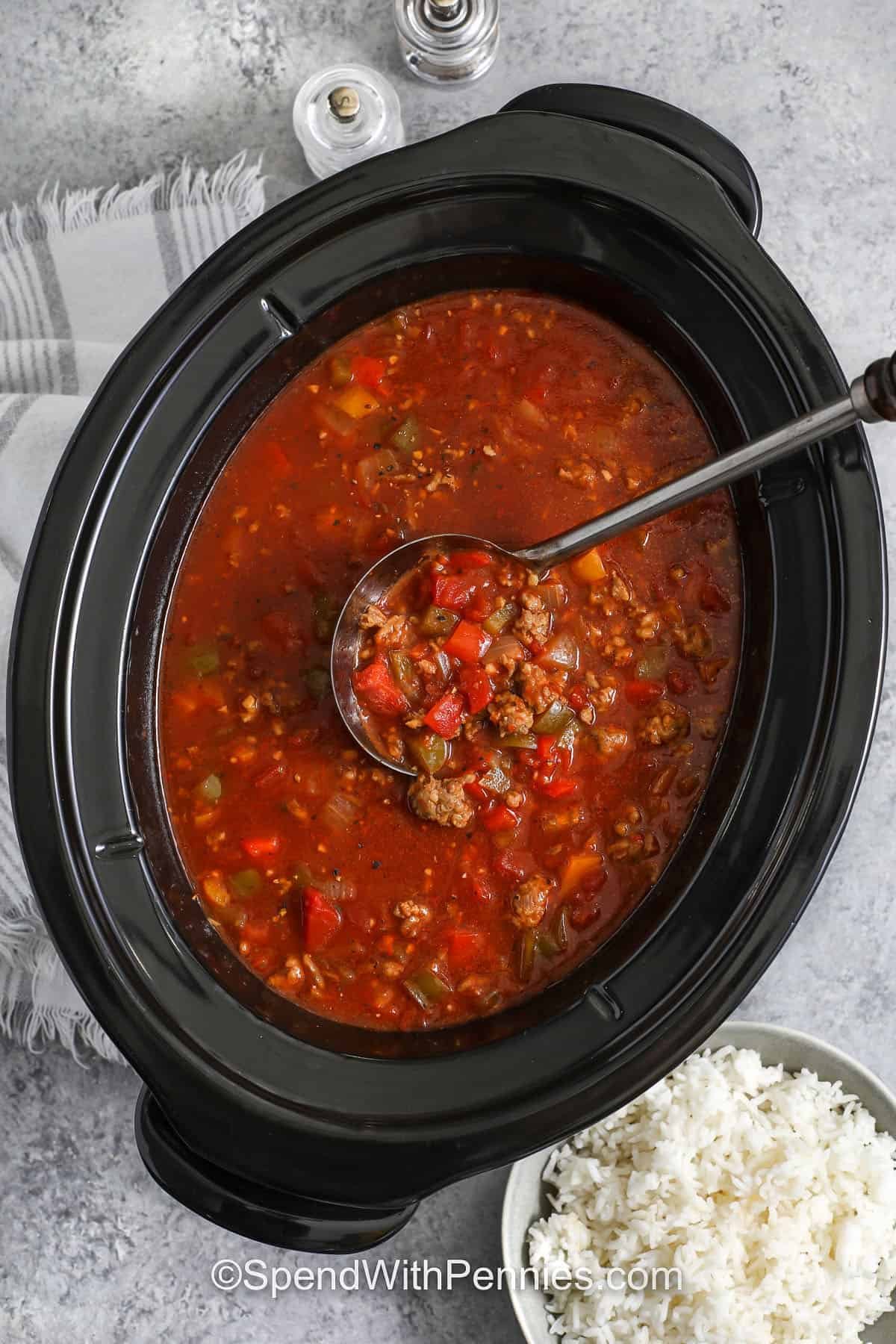 prepared slow cooker stuffed pepper soup being ladled.