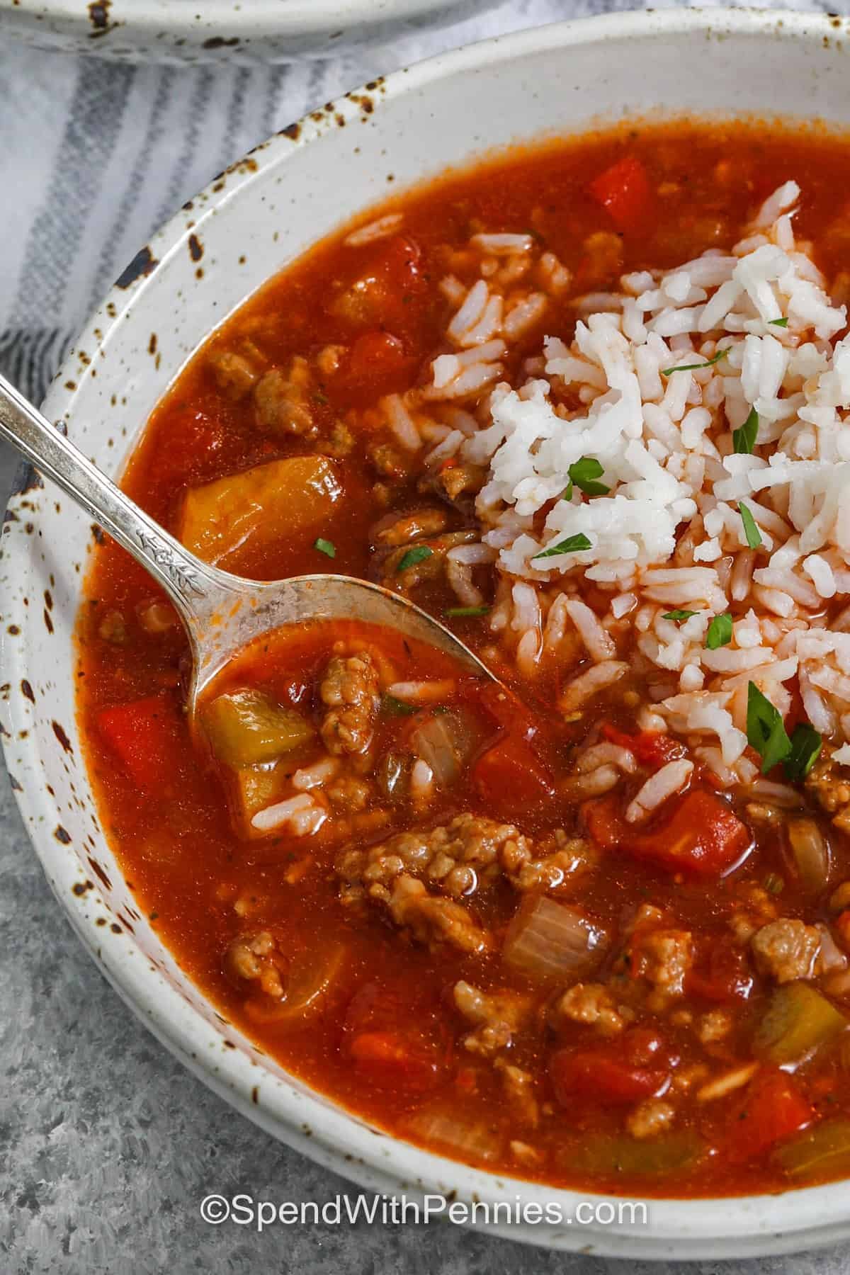 A serving of slow cooker stuffed pepper soup in a bowl