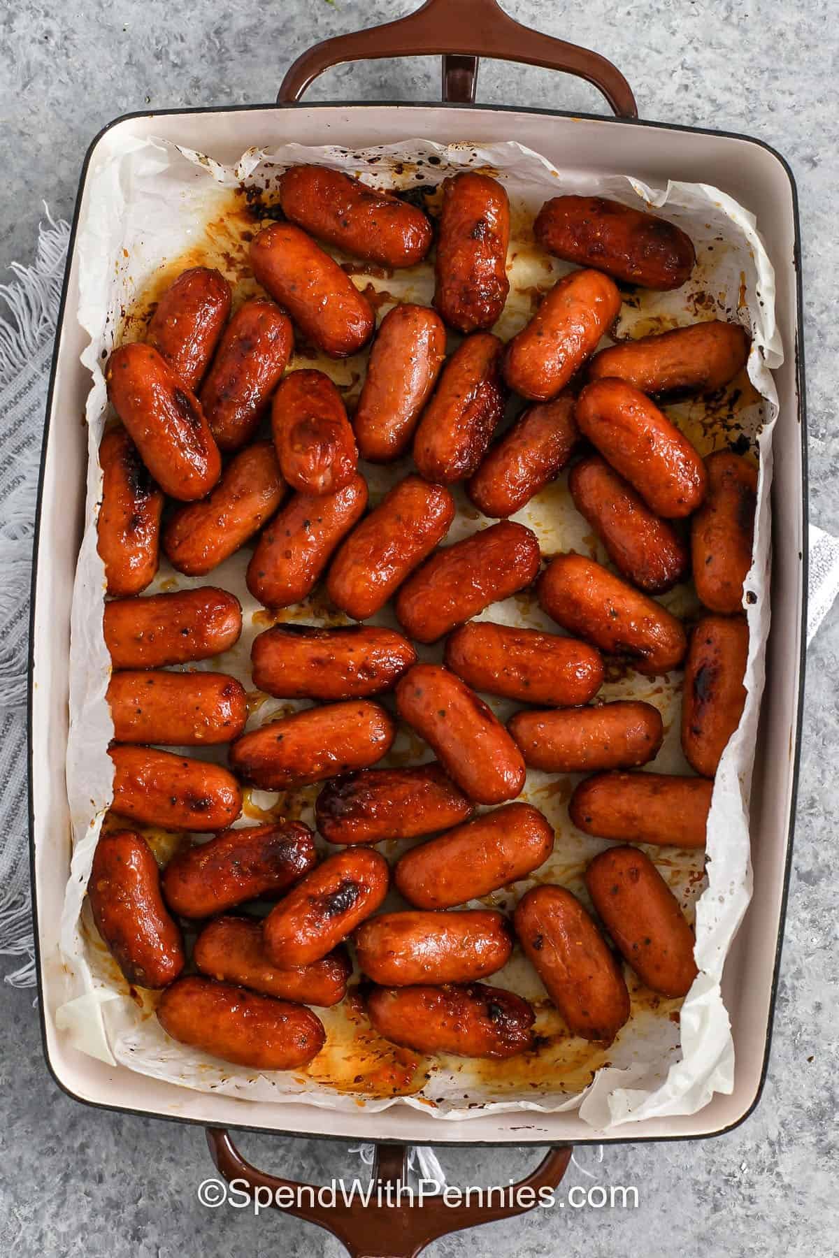 cooked Sticky Honey Mustard Sausage in a dish