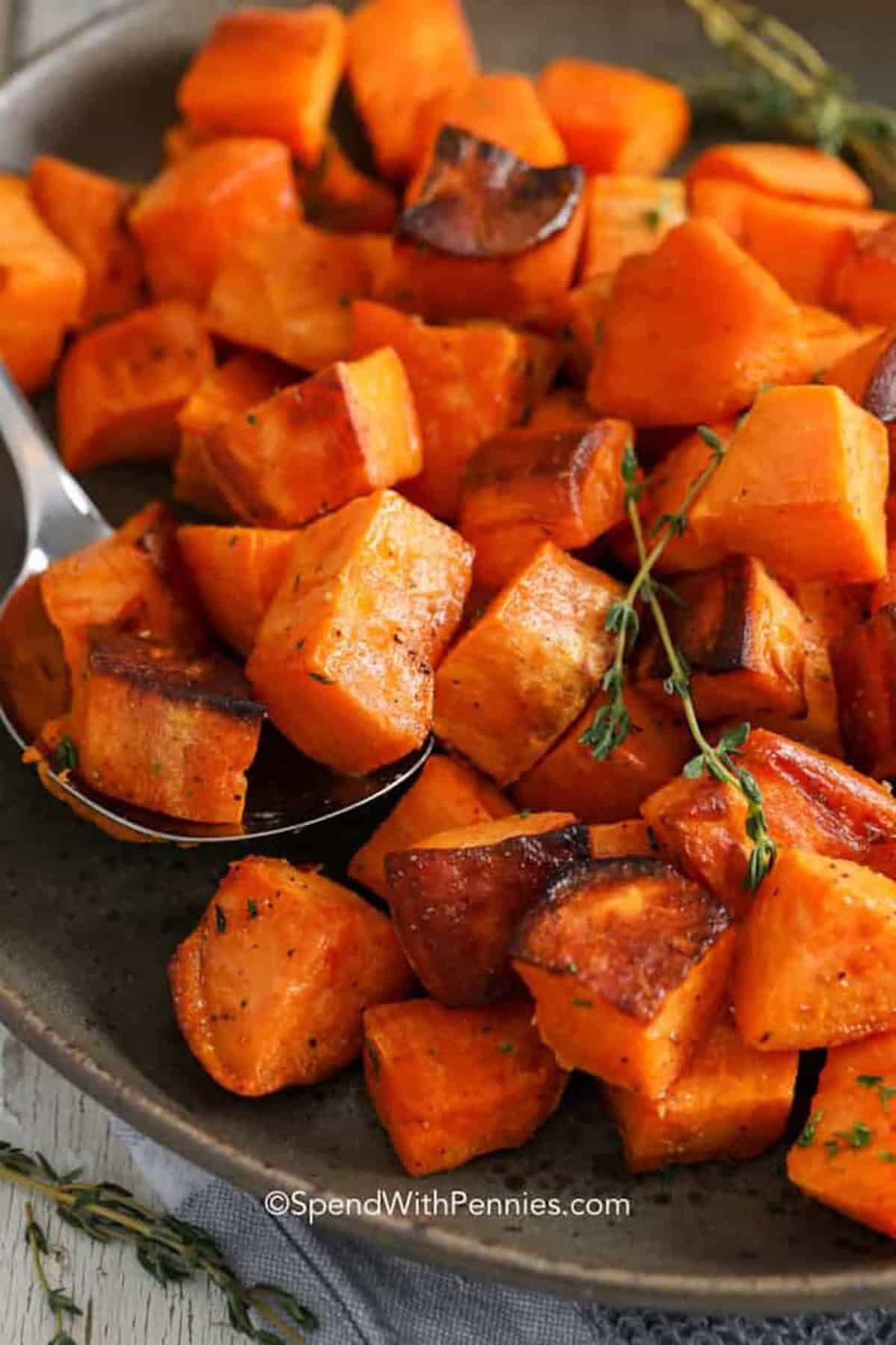 Roasted sweet potatoes are one of the easiest ways to get big flavor with minimal prep. This oven roasted sweet potatoes method uses olive oil and simple seasonings for a sweet and savory finish. Spread the cubes in a single layer so they brown instead of steam, then stir once for even color. The cinnamon option makes a warm, holiday-style variation without changing the method. #spendwithpennies plated Roasted Sweet Potatoes