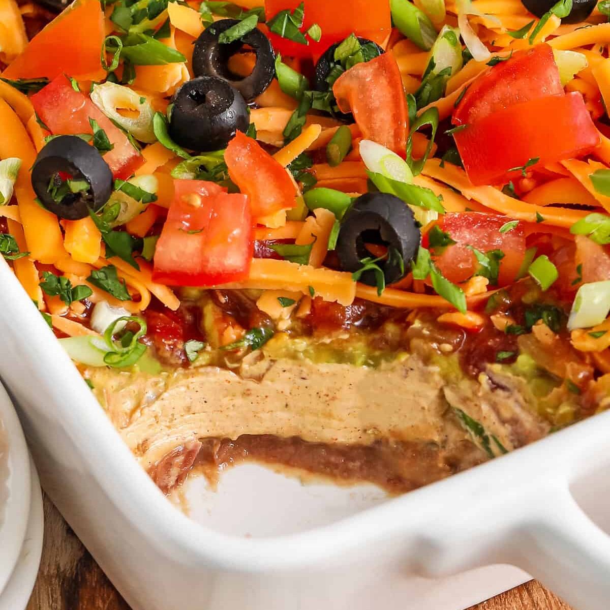 close up of 7 Layer Dip with a portion taken out