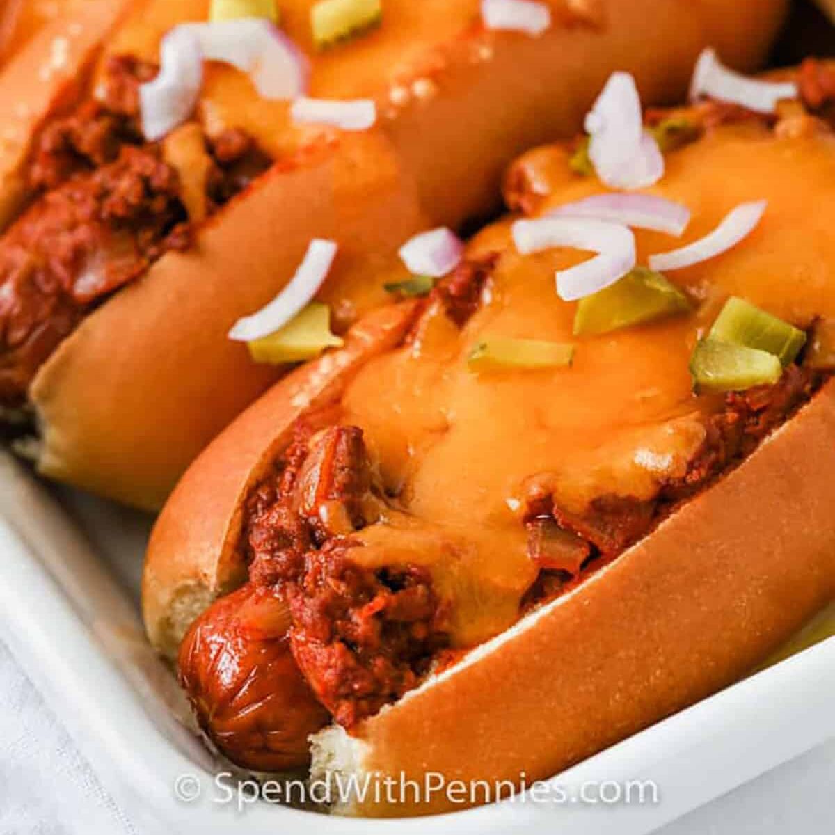 close up of Chili Cheese Dogs on a plate