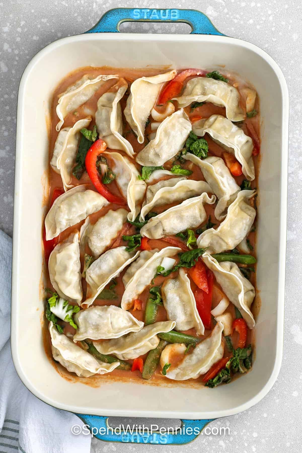 adding dumplings to casserole dish to make Dumpling Bake