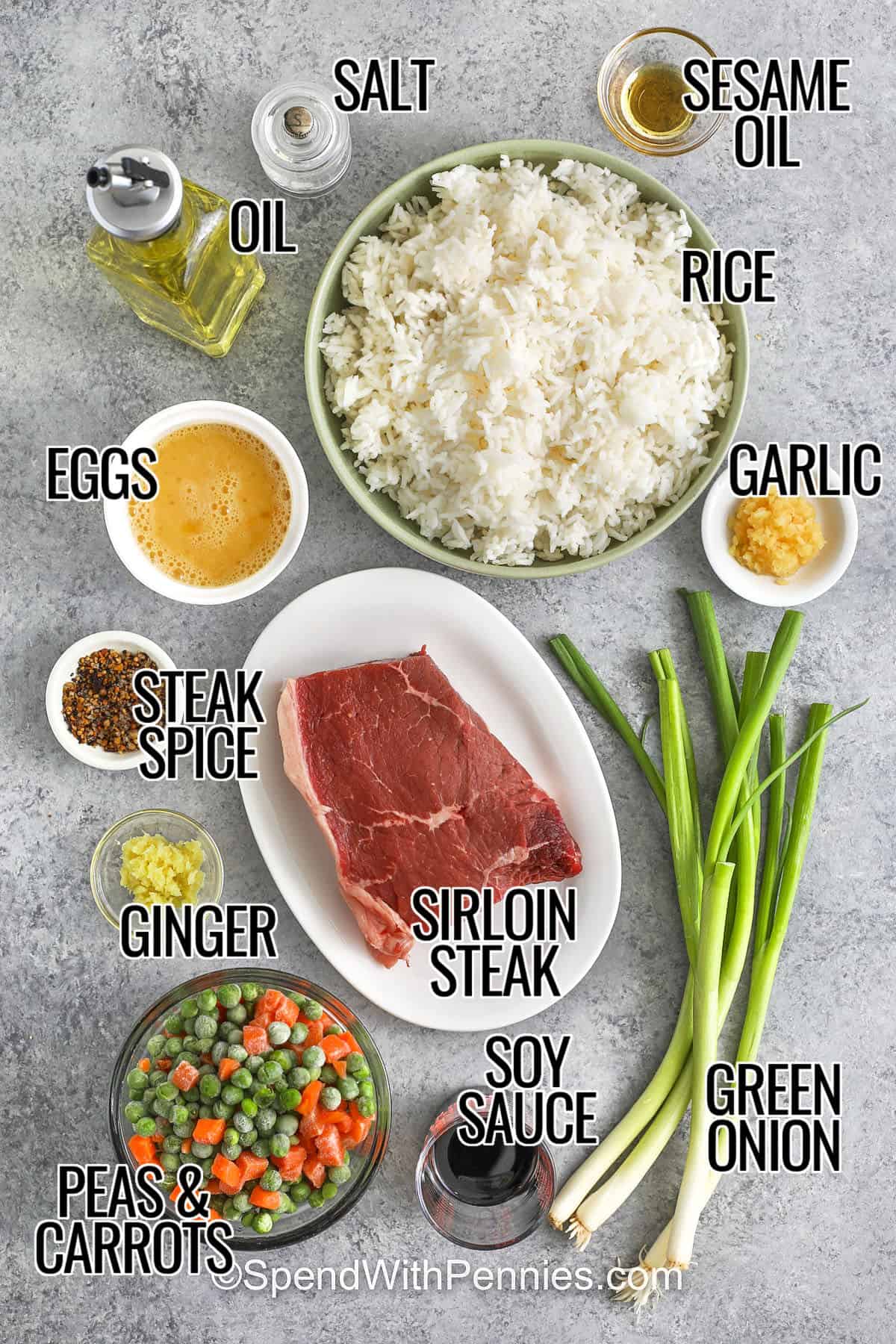 rice , oil , sesame oil , salt , garlic , eggs , steak spice , ginger , sirloin steak , soy sauce , green onion , peas and carrots with labels to make Steak Fried Rice