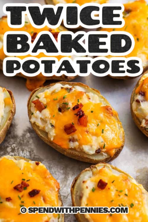 sheet pan of cheesy Twice Baked Potatoes with a title