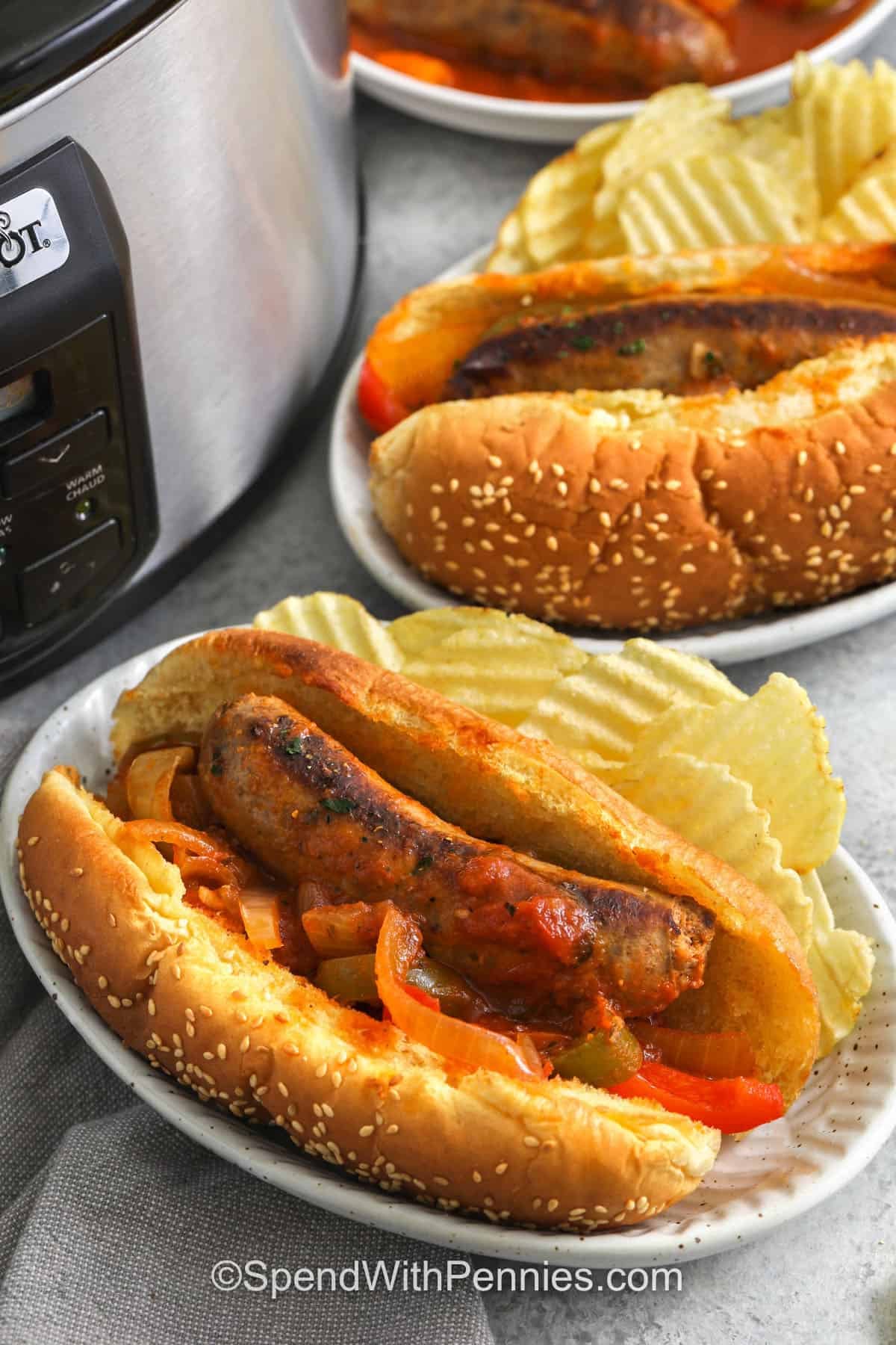 plated hot dog buns with Slow Cooker Sausage and Peppers