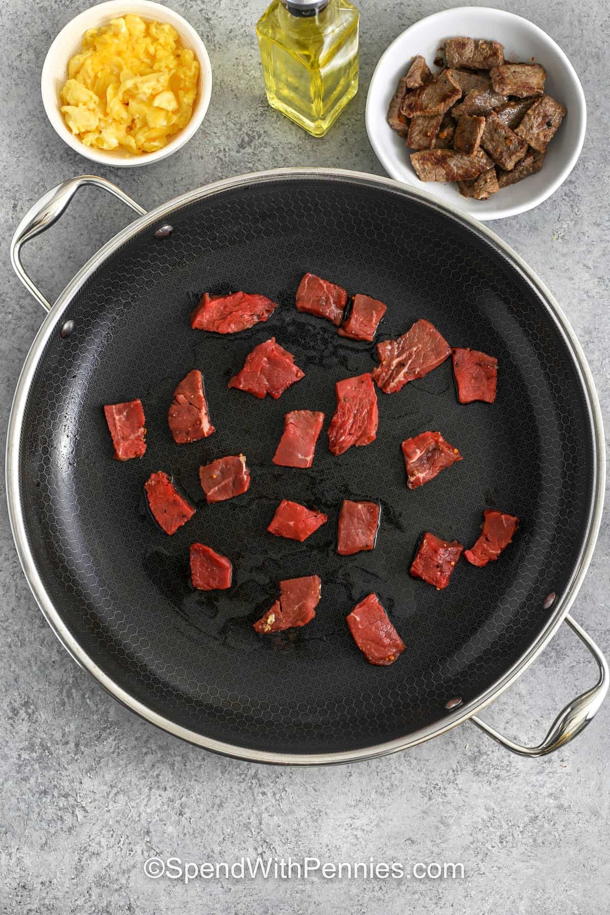 cooking steak pieces to make Steak Fried Rice