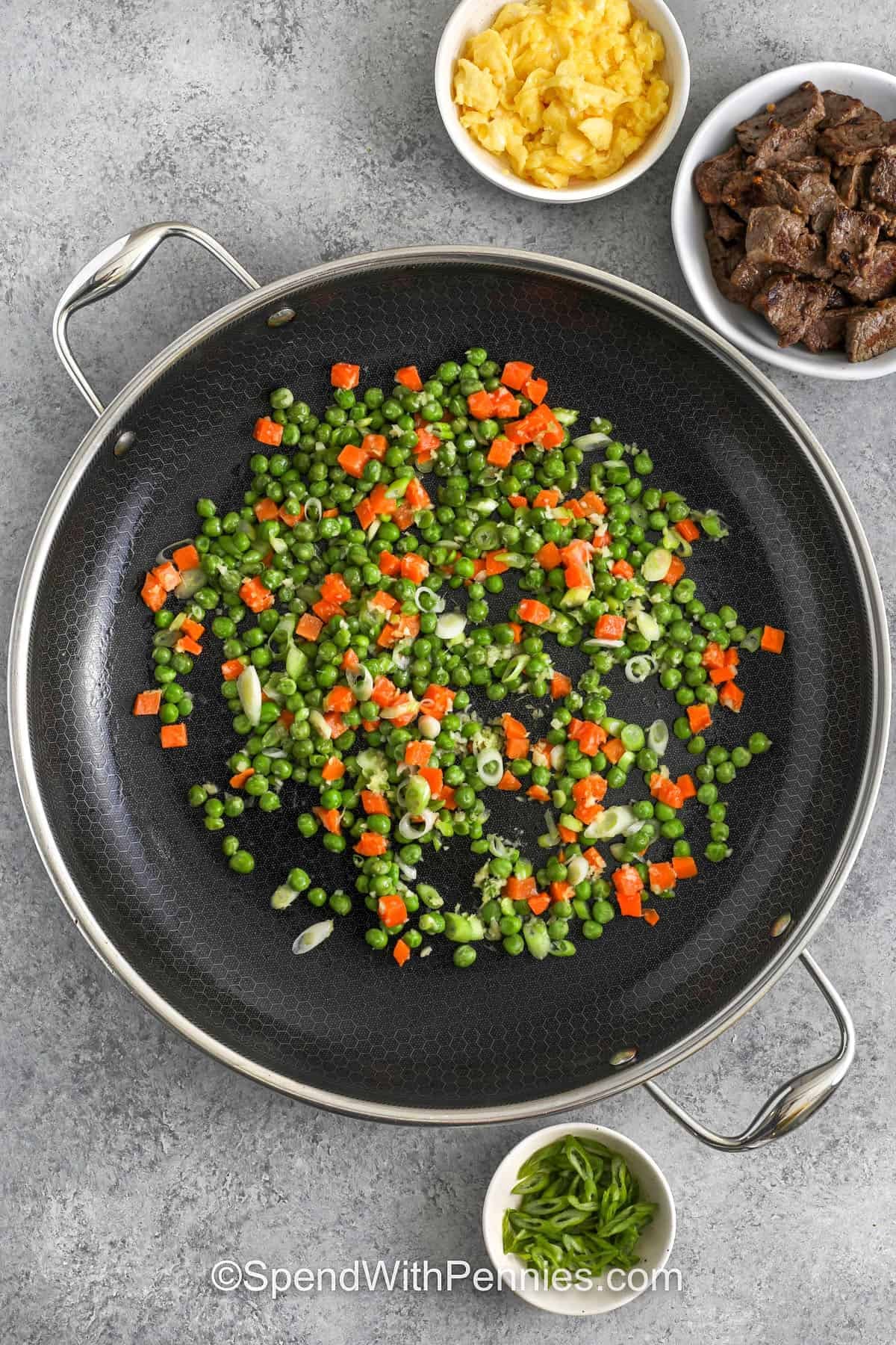 cookie peas and carrots to make Steak Fried Rice