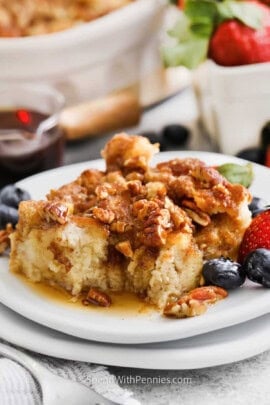 slice of French Toast Casserole on a plate with berries