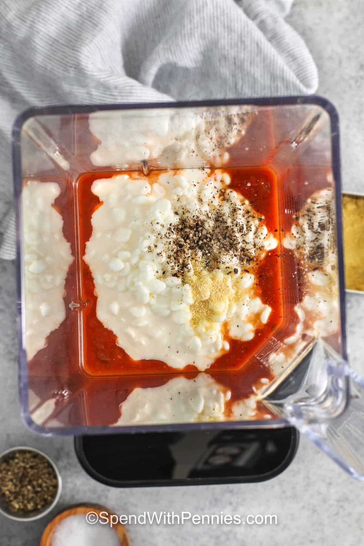 adding ingredients to blender to make Cottage Cheese Pasta Sauce