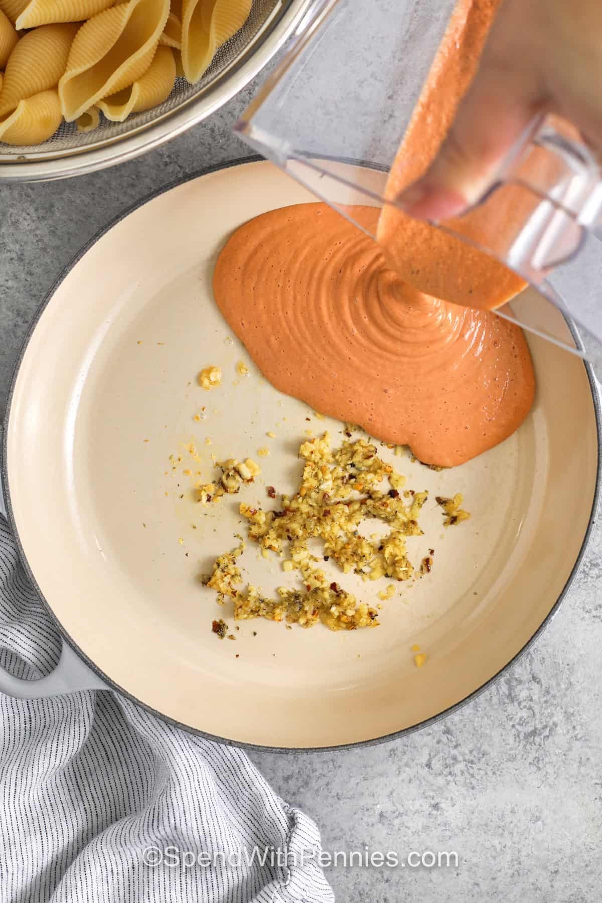 adding sauce to pan to make Cottage Cheese Pasta Sauce