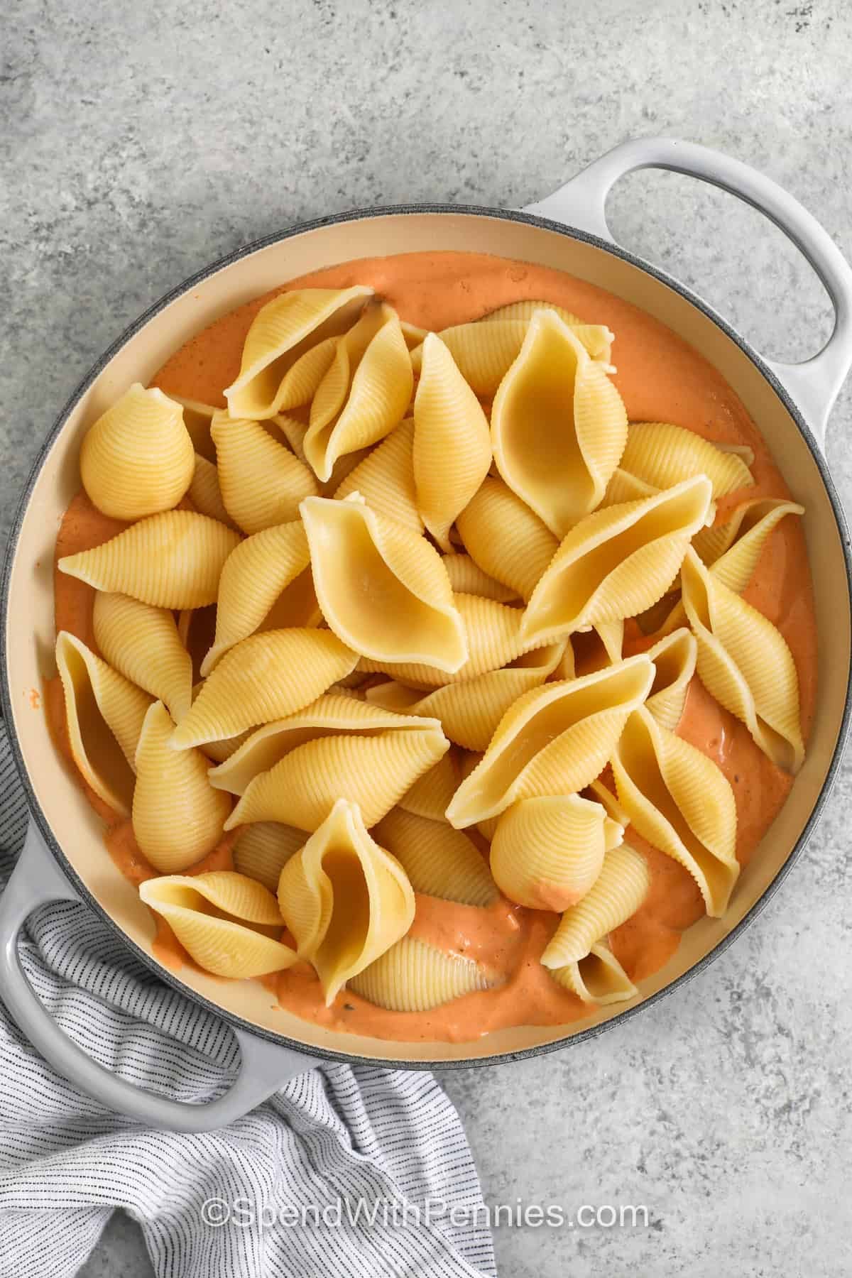 adding noodles to sauce to make Cottage Cheese Pasta Sauce