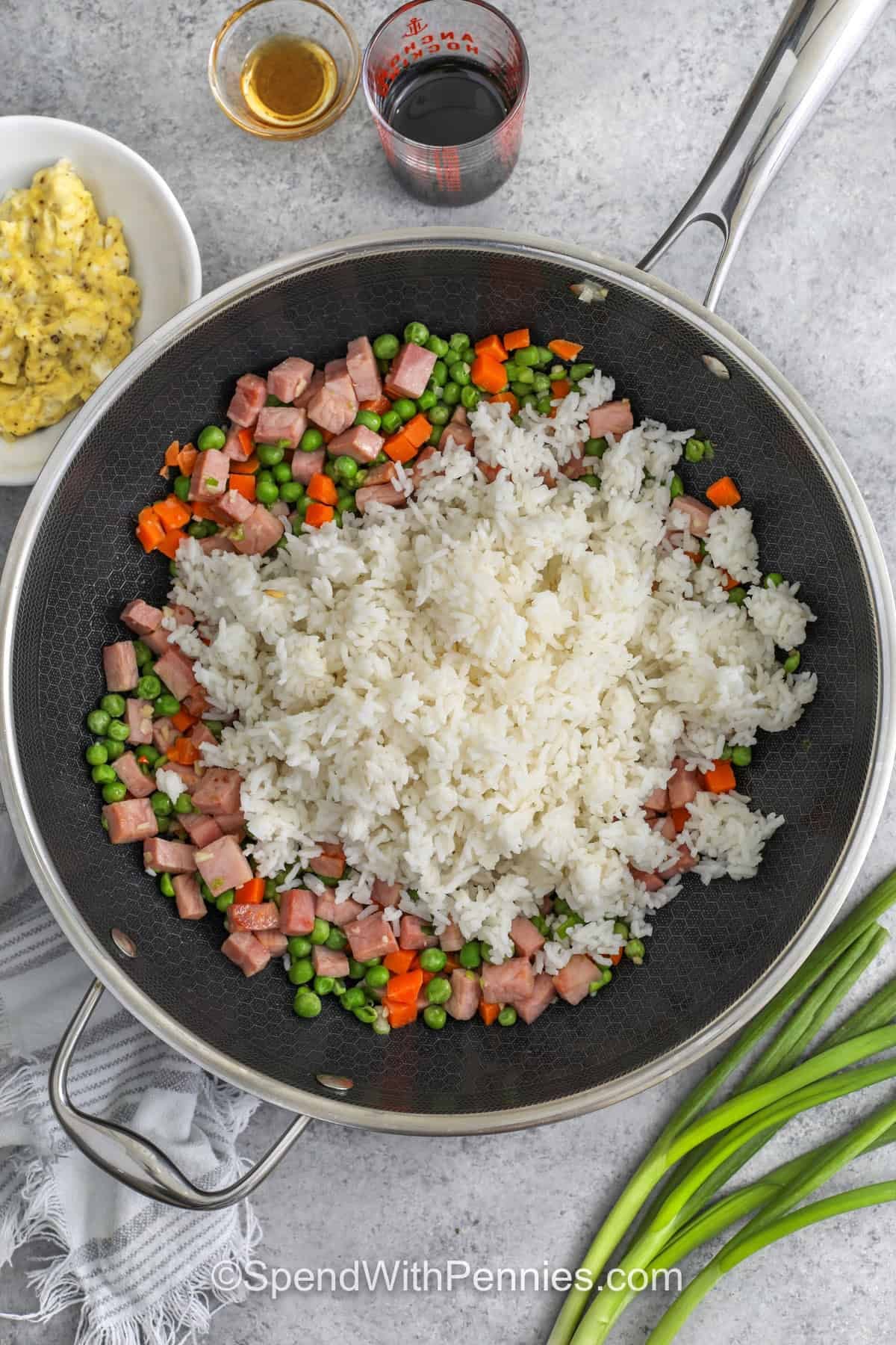 ingredients for ham fried rice in a skillet