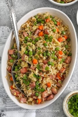 ham fried rice in a serving bowl with a spoon