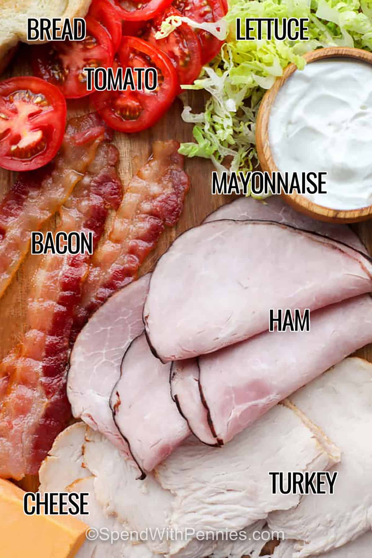 This easy club sandwich recipe uses toasted bread and a smart layer order to keep everything crisp and flavorful. Stack deli turkey, ham, crispy bacon, cheddar cheese, sliced tomato, and shredded romaine with mayonnaise for a satisfying deli-style sandwich at home. It is perfect for lunchboxes when you prep components ahead, then assemble right before eating for the best crunch and freshest taste. #spendwithpennies labelled ingredients with writing