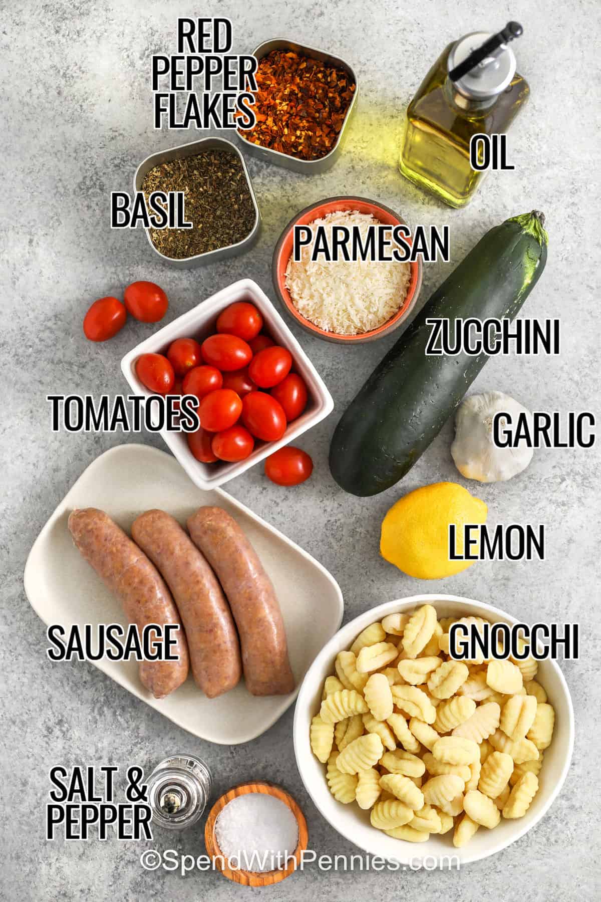 red pepper flakes , basil , oil , parmesan , tomatoes , zucchini , garlic , lemon , gnocchi , sausage , salt and pepper with labels to make Sheet Pan Gnocchi & Sausage