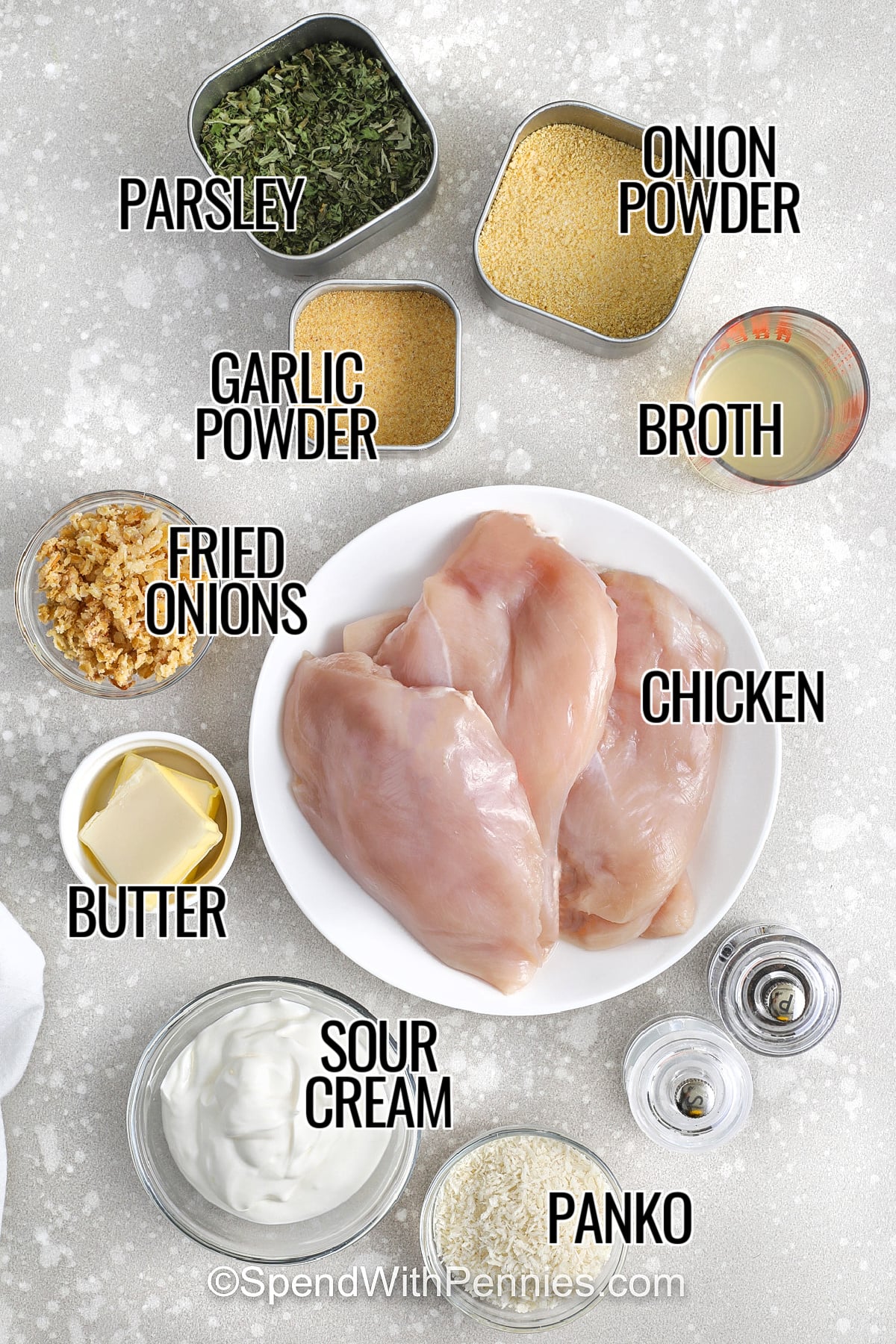 Sour cream chicken is comfort food made easy with everyday ingredients. Sour cream creates a creamy baked sauce while chicken broth keeps it spreadable and helps it bake smoothly over chicken breasts. A panko and butter topping with crispy fried onions adds a crunchy finish that everyone loves. This recipe is great for meal prep because it stores well for a few days, and it pairs with rice, potatoes, or roasted vegetables. #spendwithpennies parsley , garlic powder , onion powder , fried onions , broth , butter , sour cream , panko bread crumbs and chicken with labels to make Sour Cream Chicken