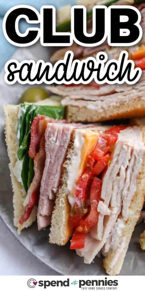 Learn how to make a classic club sandwich with turkey, ham, bacon, cheddar, lettuce, and tomato, layered between toasted bread with mayonnaise. Patting the tomato dry and using crisp romaine helps keep the sandwich fresh and sturdy. This quick recipe is great for busy weeknights, and the ingredients can be prepped ahead so you can stack and slice right before serving. #spendwithpennies plated club sandwich with writing