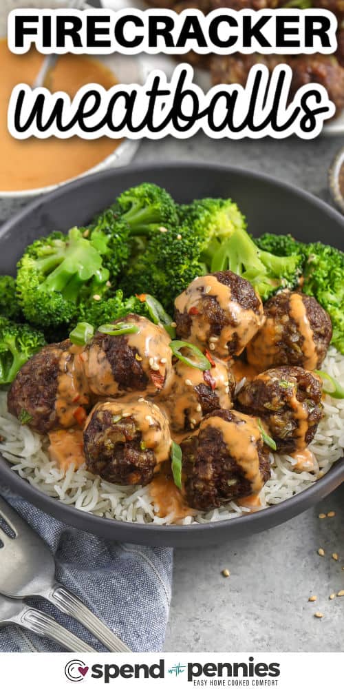 Make firecracker meatballs when you want sweet heat flavor with minimal dishes. The meatballs bake on a sheet pan while the creamy firecracker sauce whisks in one bowl using mayonnaise, sriracha, soy sauce, and honey. Top with sliced green onions and toasted sesame seeds for extra crunch and freshness. Serve as an appetizer platter or an easy dinner over rice. #spendwithpennies firecracker meatballs in a bowl with rice and broccoli with writing
