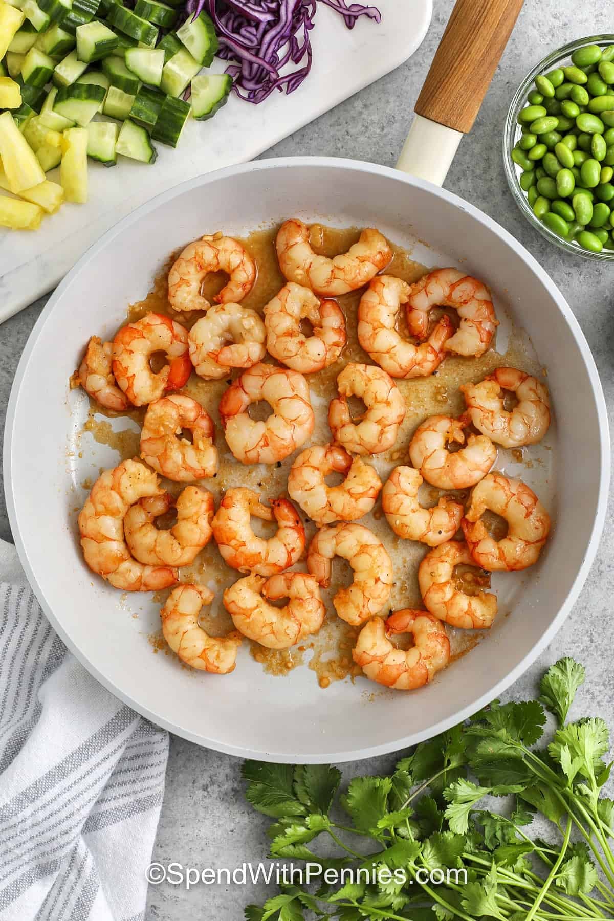 marinated shrimp being cooked in a frying pan