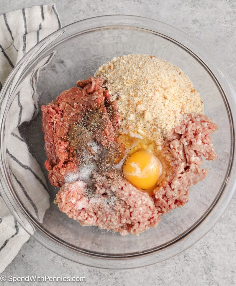 A bowl of raw meatball ingredients for Swedish meatballs