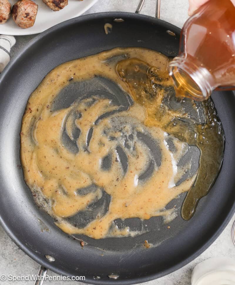 Adding broth to the Swedish meatball sauce