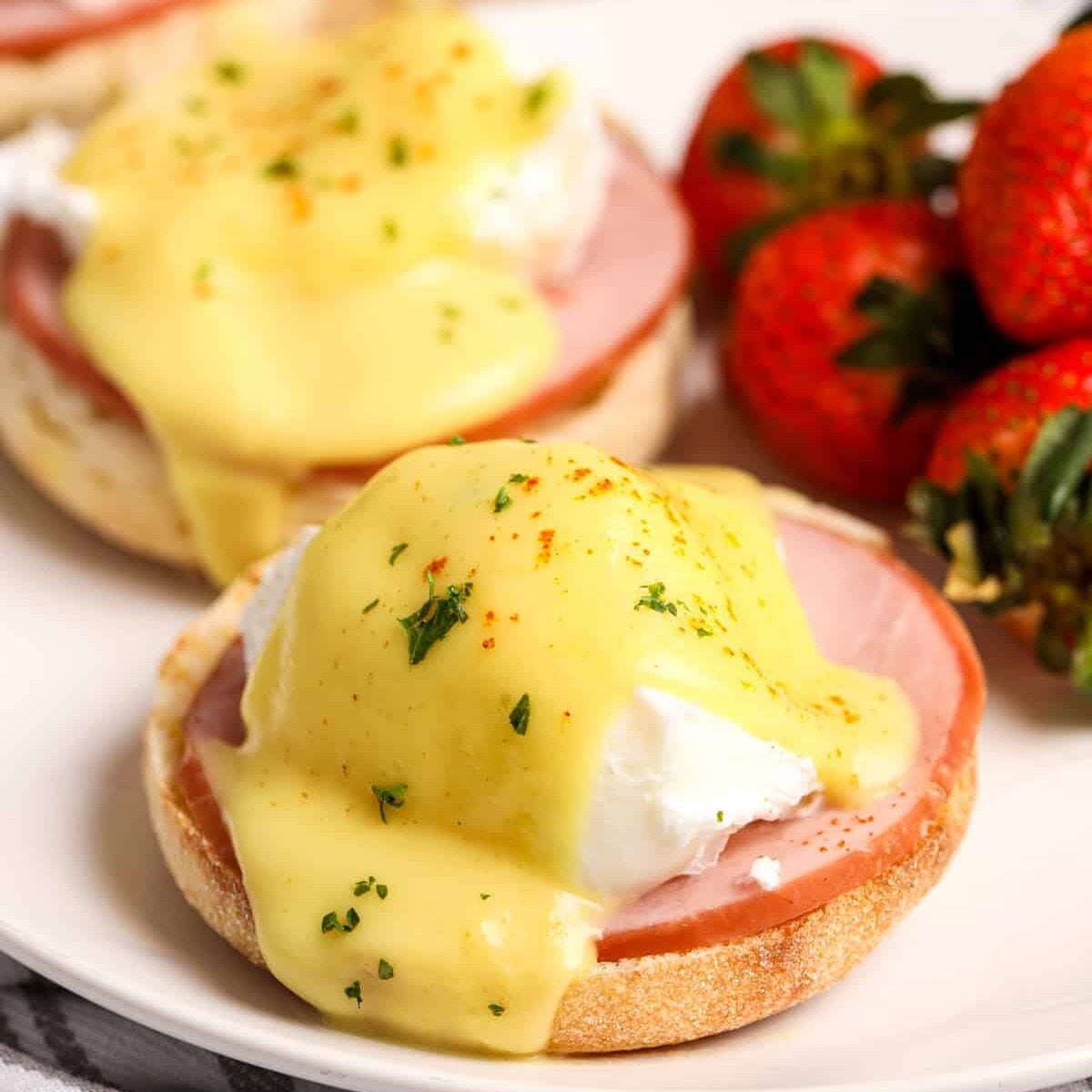 plated Eggs Benedict with strawberries