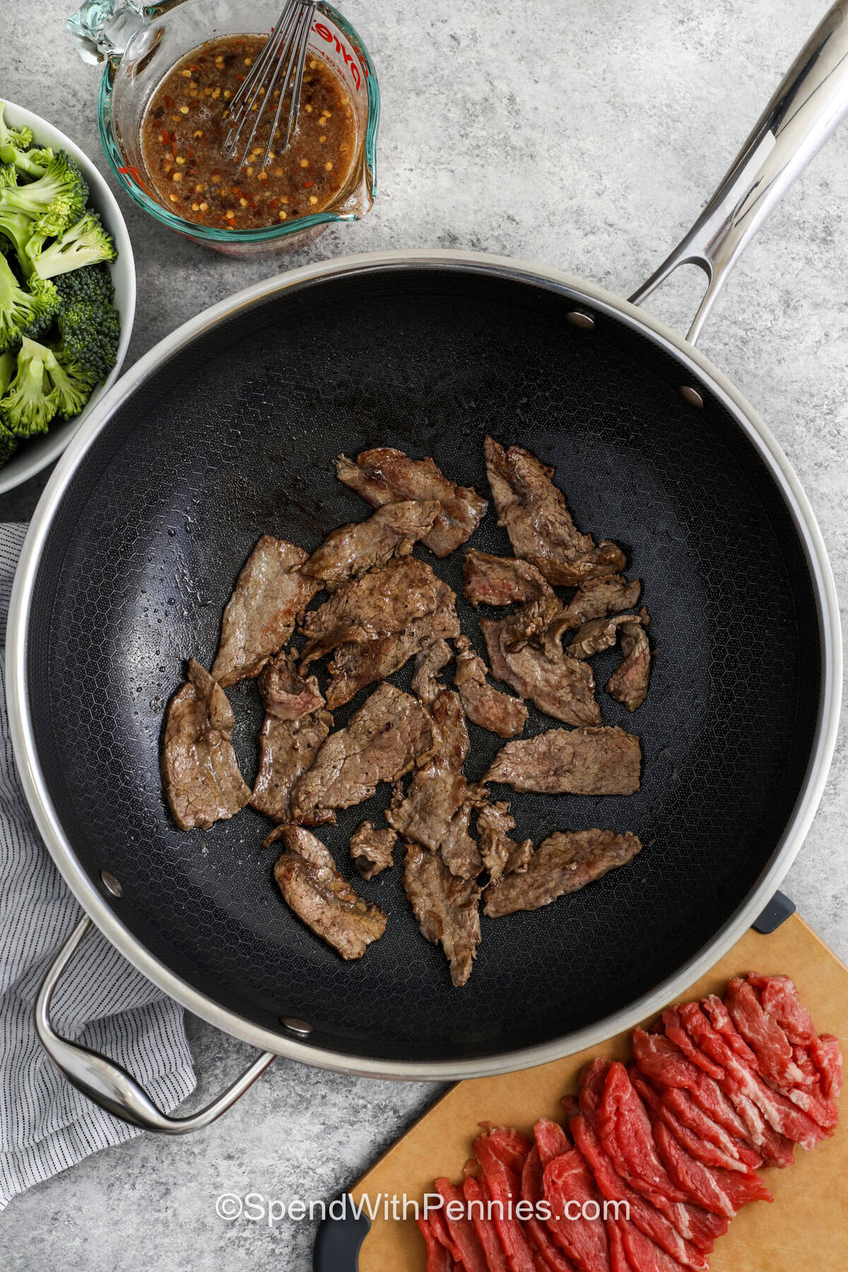 This beef and broccoli recipe is a meal prep friendly option that still feels like comfort food. Tender steak and broccoli hold up well in the fridge, and the soy-garlic sauce reheats beautifully for lunch or dinner later in the week. With a one-pan cooking method and takeout-inspired flavor, it is a dependable recipe for busy home cooks who want something easy and delicious. #spendwithpennies cooking beef slices to make Beef and Broccoli Recipe