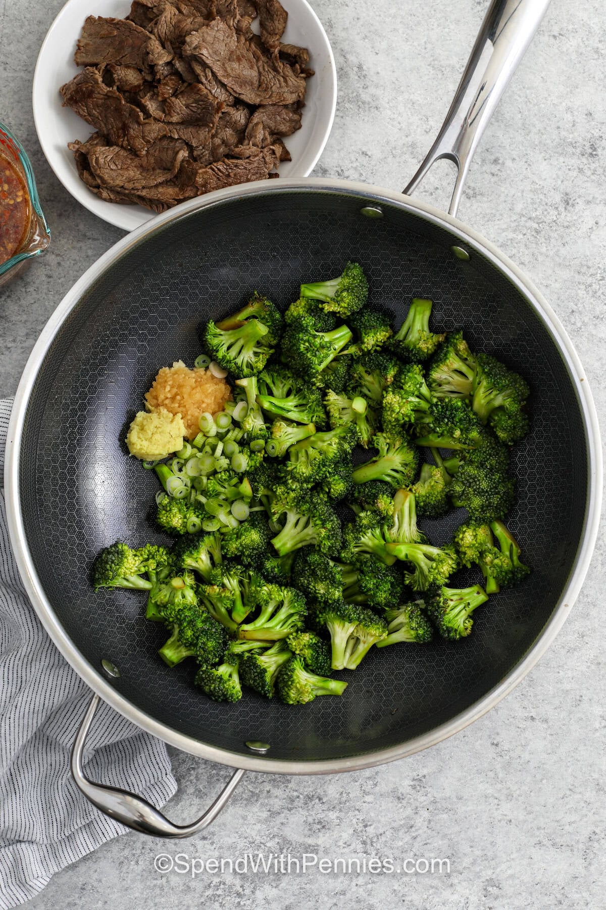 This homemade beef and broccoli recipe is perfect for nights when you need something filling and flavorful with very little fuss. The sauce comes together with pantry staples, the broccoli cooks quickly, and the whole skillet dinner is ready to spoon over warm rice. It has the right mix of savory richness, slight sweetness, and fresh green crunch in every bite. #spendwithpennies cooking broccoli to make Beef and Broccoli Recipe