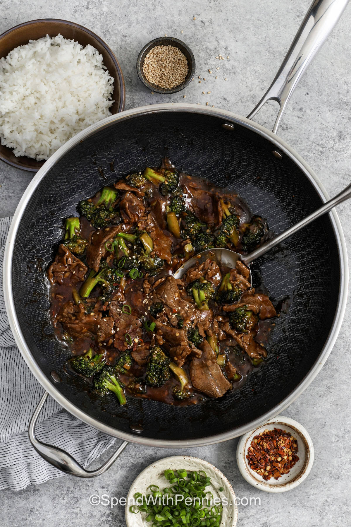 This beef and broccoli recipe brings together tender beef, bright broccoli florets, and a simple sauce that tastes like it came from your favorite takeout spot. Cooking the beef in batches gives better browning, while the broccoli adds freshness and texture. It is an easy skillet recipe that feels balanced, comforting, and especially useful for quick dinners at home. #spendwithpennies Beef and Broccoli Recipe in the pan with a spoon