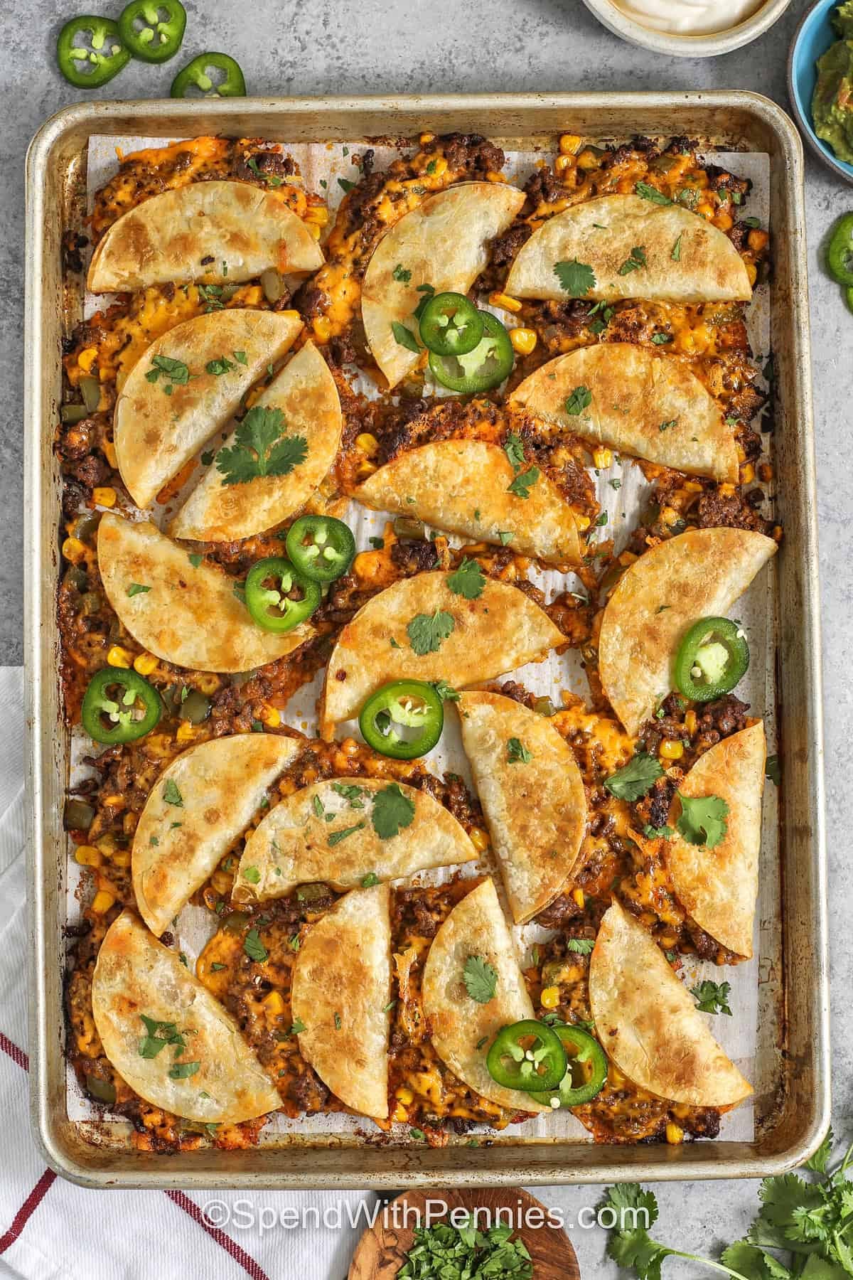 top view of crispy tacos on a baking sheet