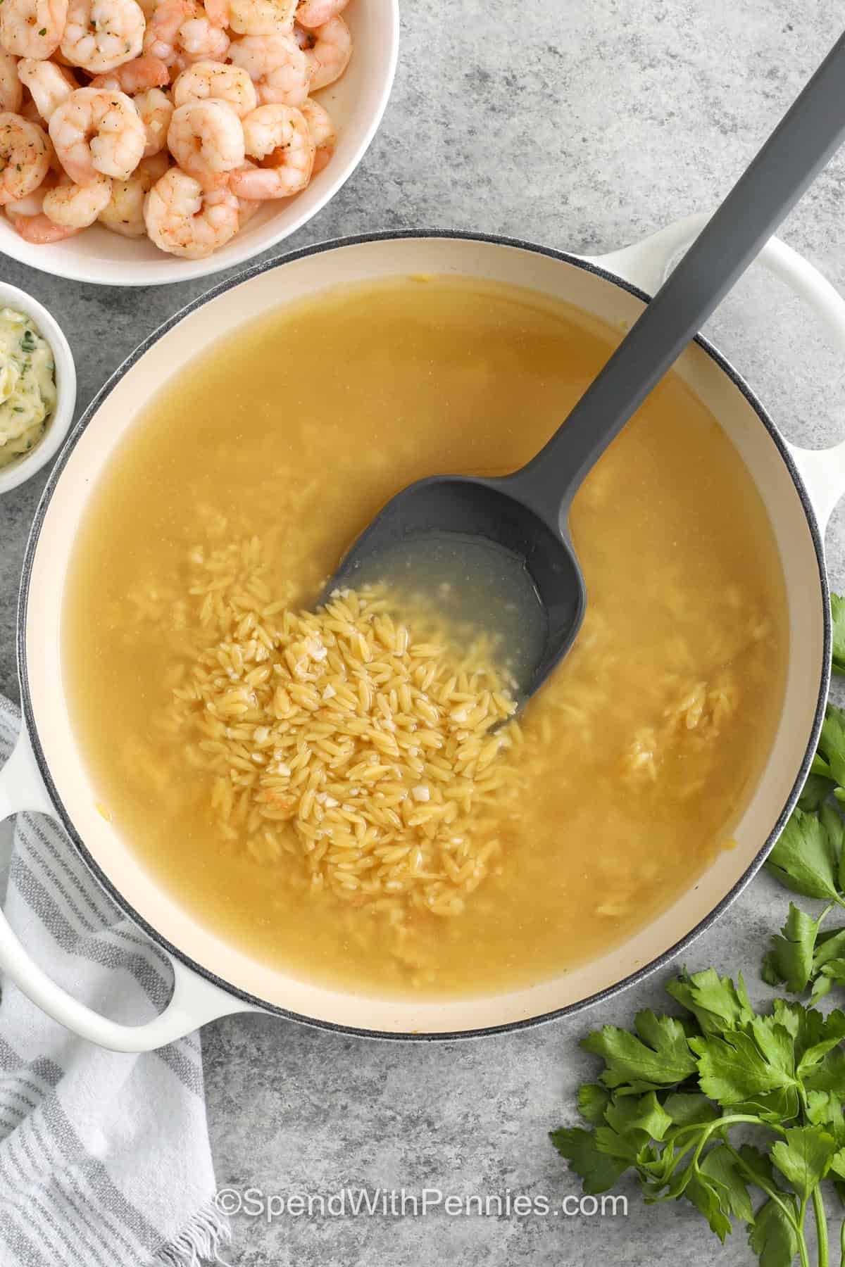 cooking orzo in the pot to make Garlic Butter Shrimp Orzo