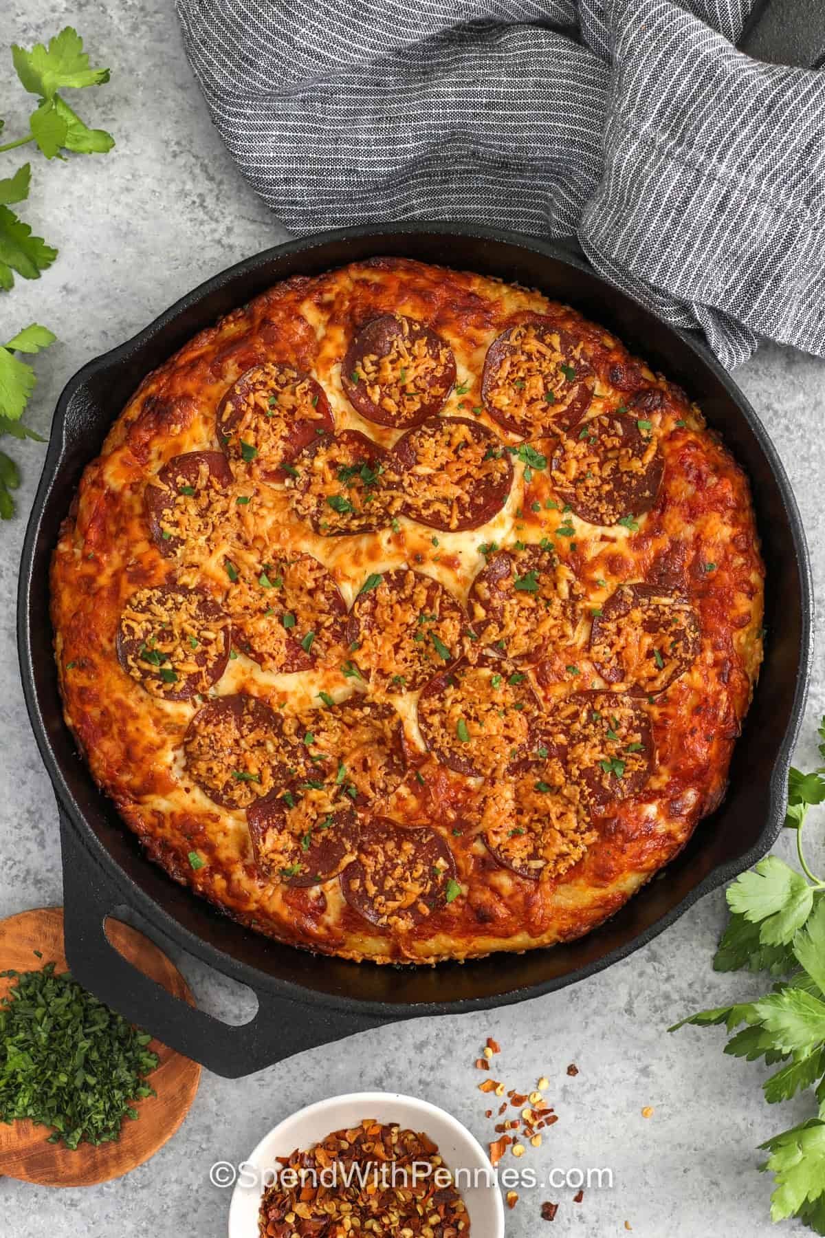 This cast iron pan pizza delivers that irresistible mix of crispy crust, gooey cheese, and savory pepperoni in every bite. Olive oil in the skillet helps brown the bottom and edges, giving the pizza its signature texture. It is a practical recipe for weeknights, small gatherings, or casual weekends, especially when you want the comfort of homemade pizza without making everything from scratch. #spendwithpennies Homemade Pan Pizza in the pan
