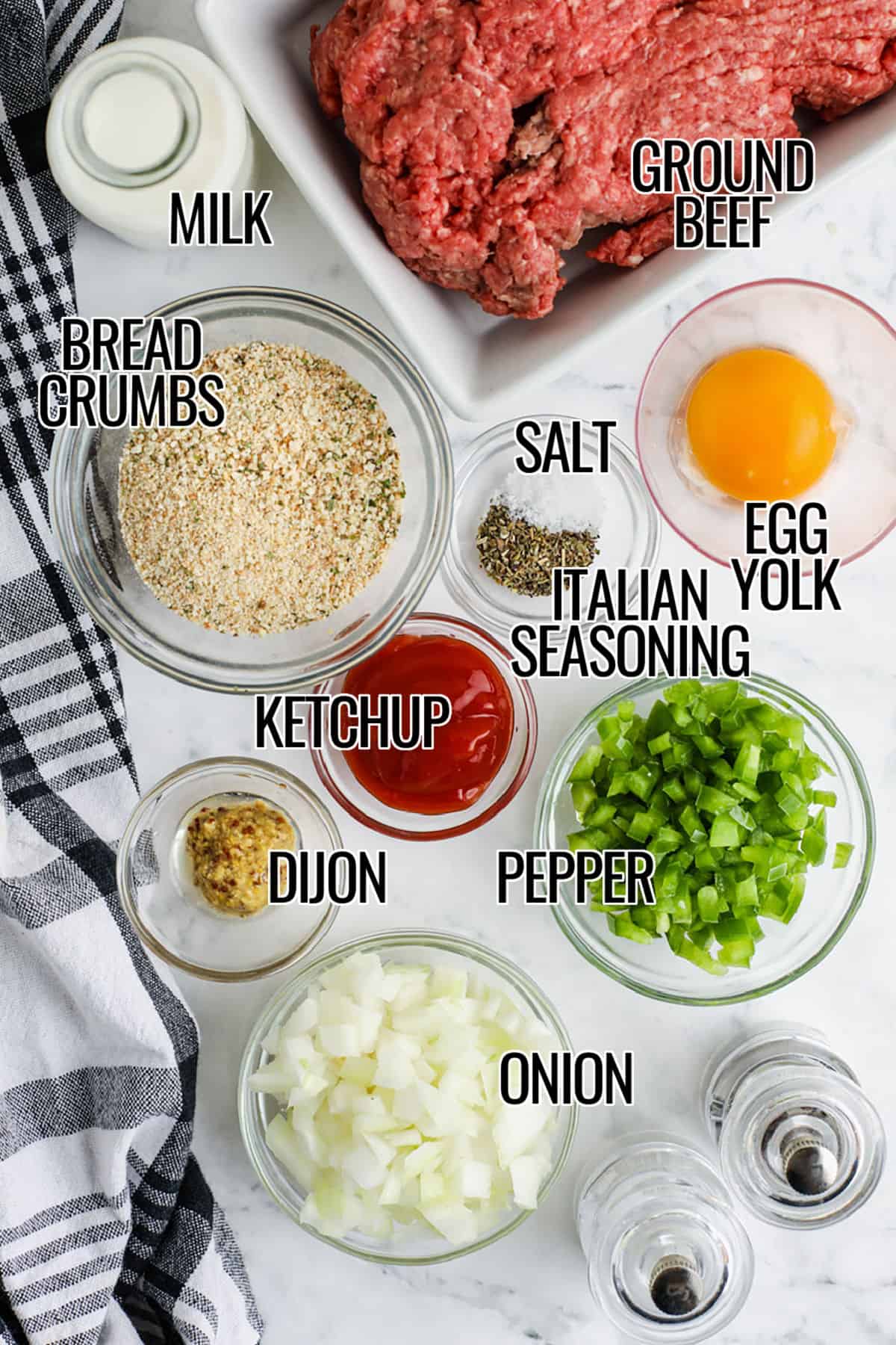 This mini meatloaf recipe is a practical dinner idea for busy home cooks because it is easy to make, easy to portion, and easy to serve. These individual meatloaves have a tender texture from milk and breadcrumbs, rich flavor from beef and cooked vegetables, and a glossy ketchup chili sauce on top. Serve them fresh from the oven with simple sides or freeze extras for another night when you need a homemade dinner without extra work.#spendwithpennies milk , ground beef , bread crumbs , salt , Italian seasoning , egg yolk , pepper , ketchup , dijon , onion with labels to make Mini Meatloaf Recipe