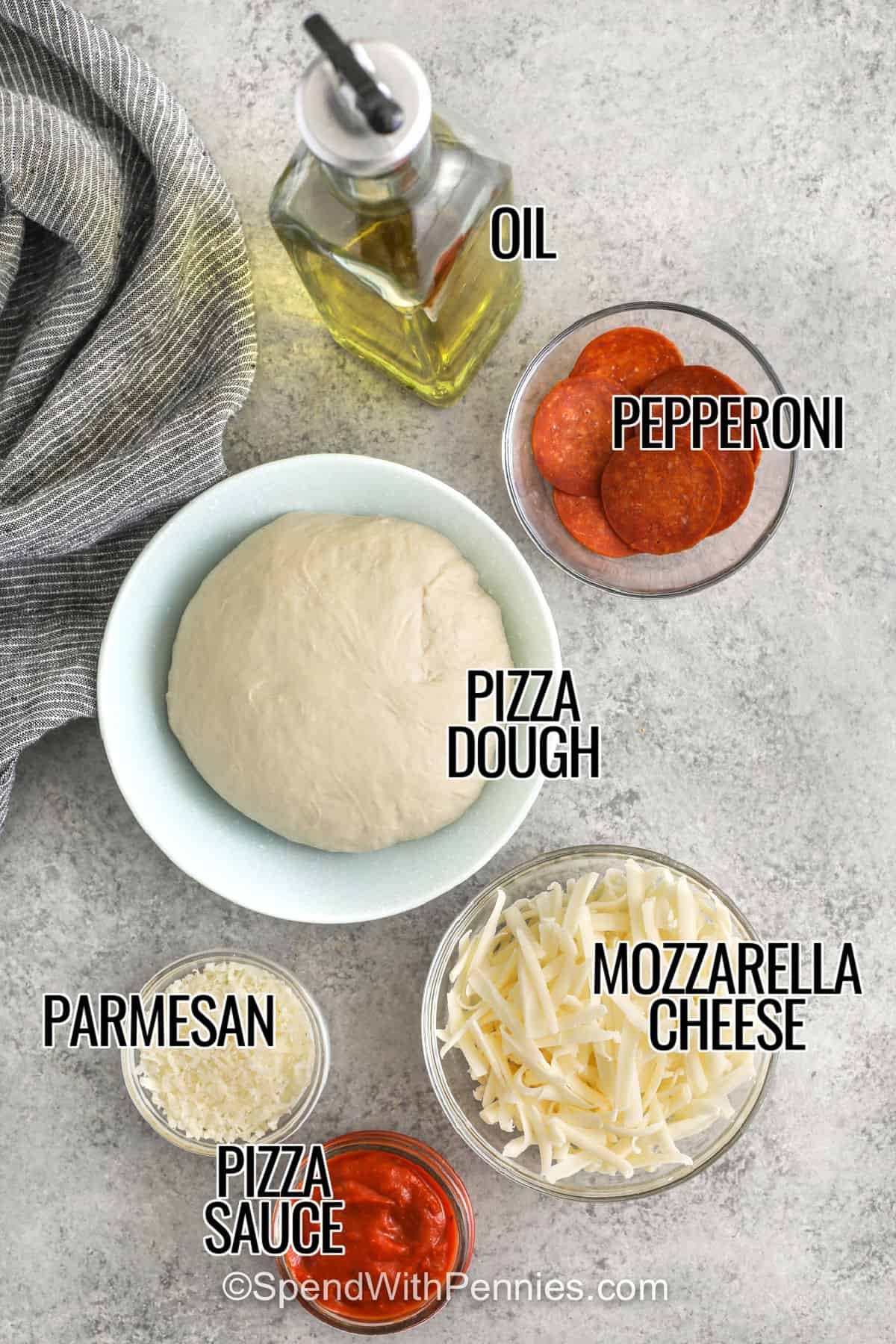 This pan pizza is baked in a cast-iron skillet so the crust turns crisp and golden around the edges while staying soft and chewy in the center. A layer of pizza sauce, shredded mozzarella, pepperoni, and Parmesan gives it classic pizzeria flavor without a lot of prep. It is a great homemade dinner for busy nights when you want something cozy, familiar, and easy to slice and serve. #spendwithpennies oil , pepperoni , pizza dough , mozzarella cheese , parmesan cheese , pizza sauce with labels to make Pan Pizza