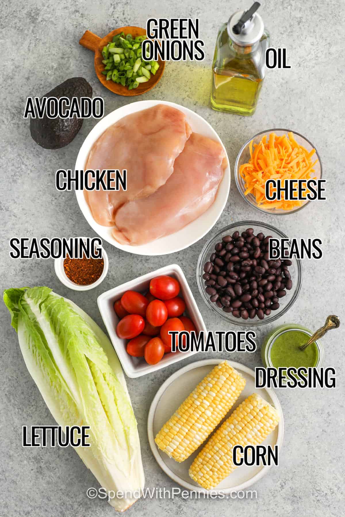 avocado , green onions , oil , chicken , cheese , beans , seasoning , tomatoes , dressing , corn and lettuce to make Southwest Salad