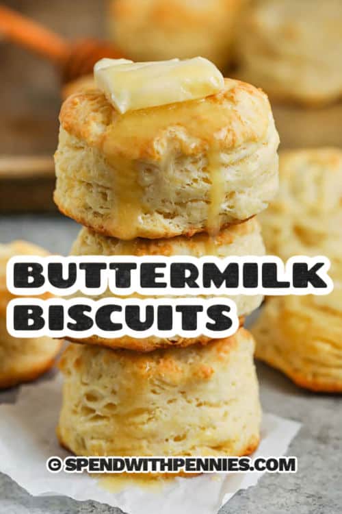 stack of Homemade Buttermilk Biscuits with butter and a title