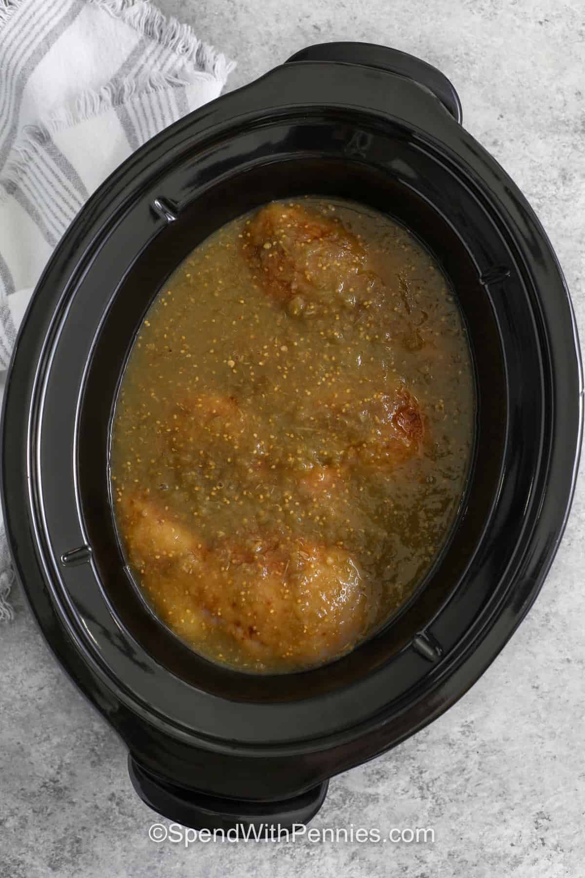 adding salsa verde to chicken in crockpot to make Salsa Verde Chicken