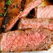 a close up of steak that has been marinating in steak marinade and then grilled